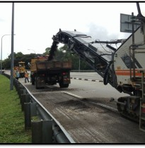 Scrapping existing asphalt pavemment