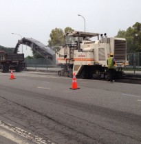 Scrapping existing asphalt pavement